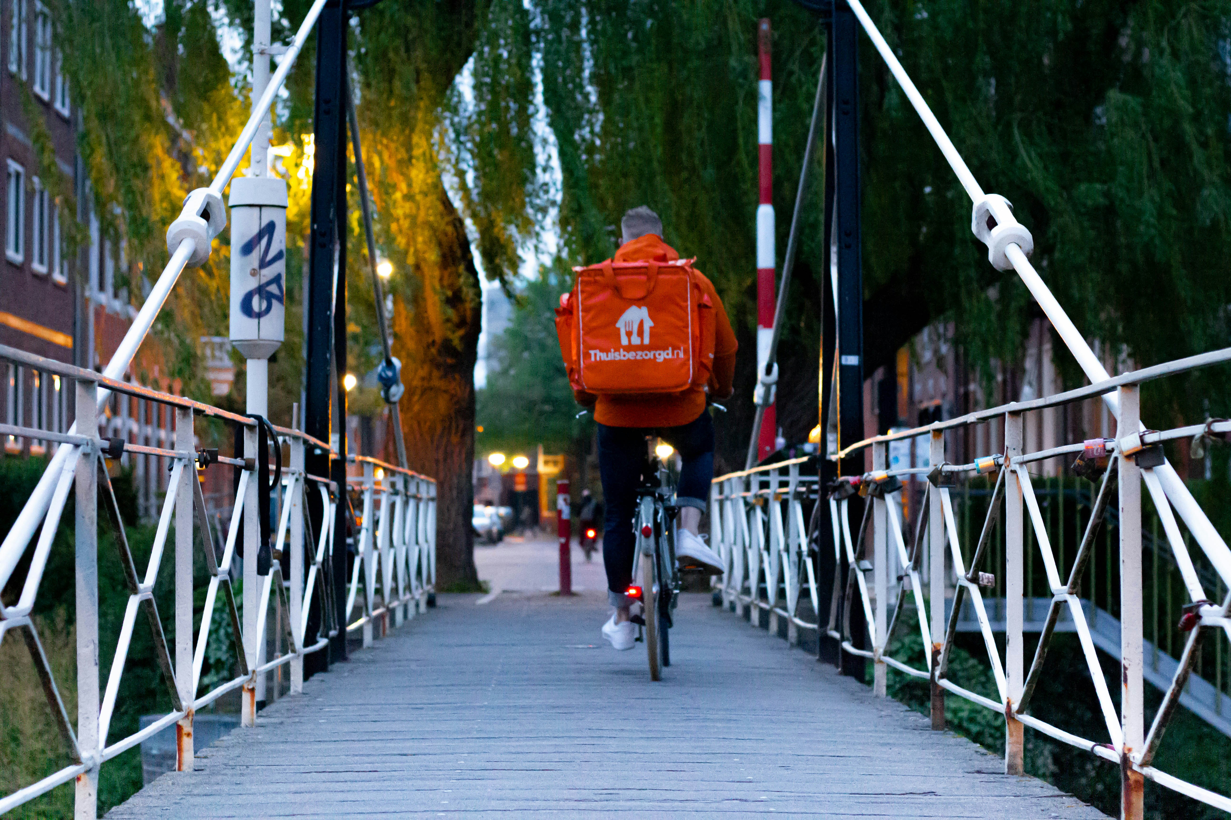 A person riding a bike to delivery food